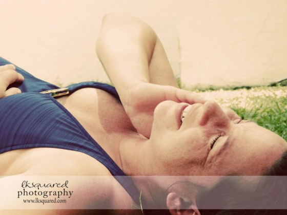 Sam laughing in the grass